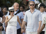 Prince Harry and Meghan arrive Aug. 17 in San Basilio de Palenque, Colombia.