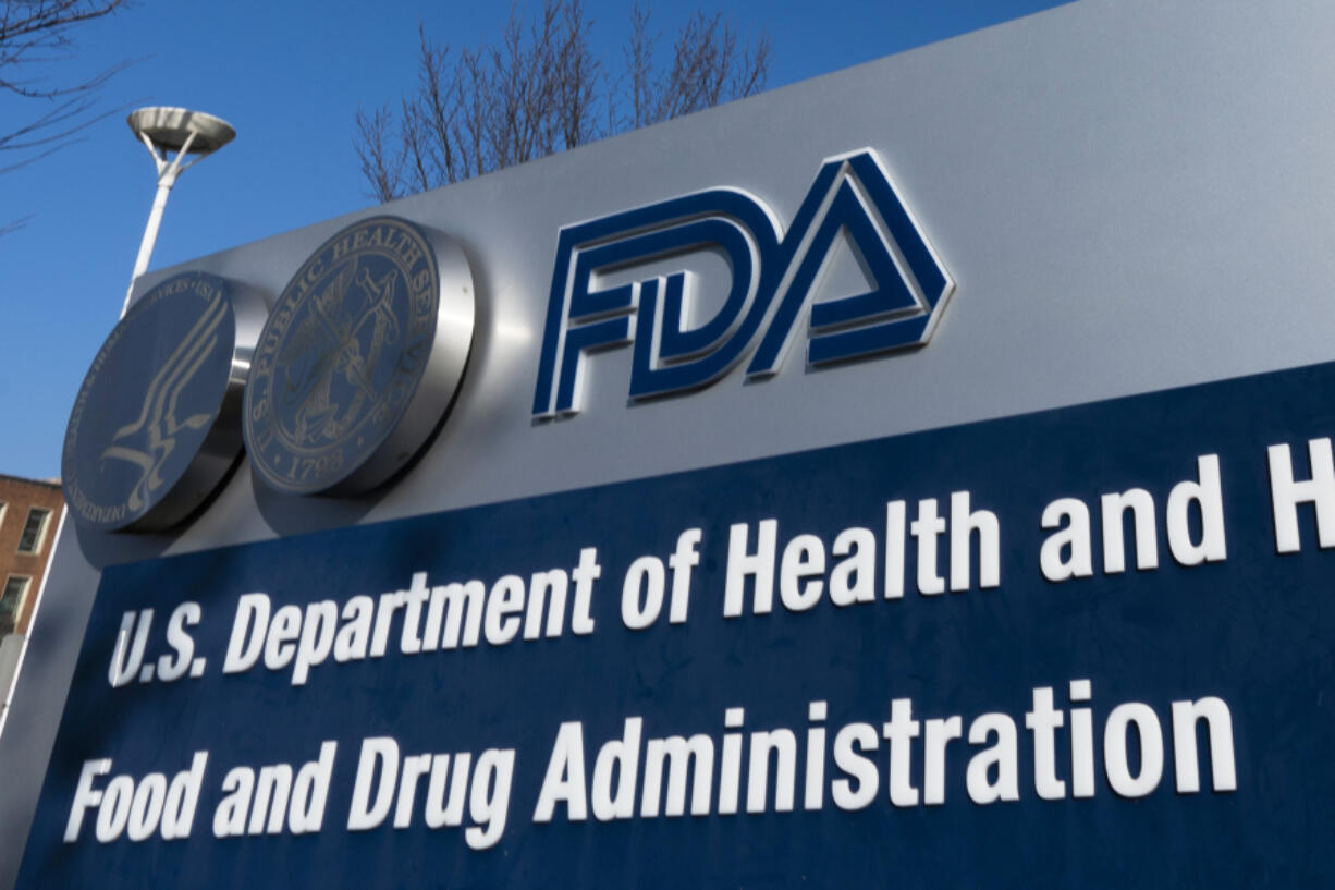 FILE - A sign for the U.S. Food and Drug Administration is displayed outside their offices in Silver Spring, Md., Dec. 10, 2020.