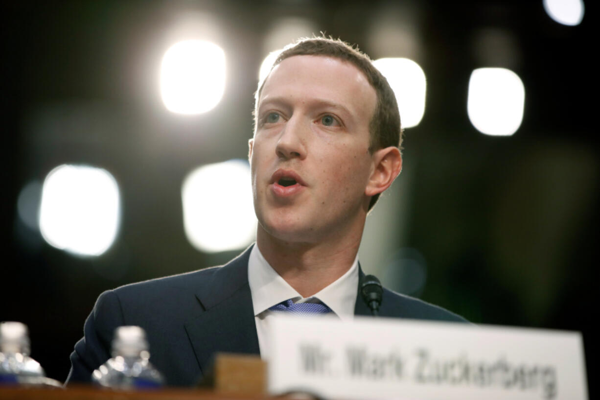 FILE - Facebook CEO Mark Zuckerberg testifies before a joint hearing of the Commerce and Judiciary Committees on Capitol Hill in Washington, April 10, 2018.