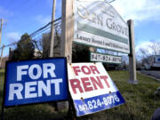 FILE - Signs for apartment rentals are displayed in Glenview, Ill., Jan. 29, 2024. (AP Photo/Nam Y.