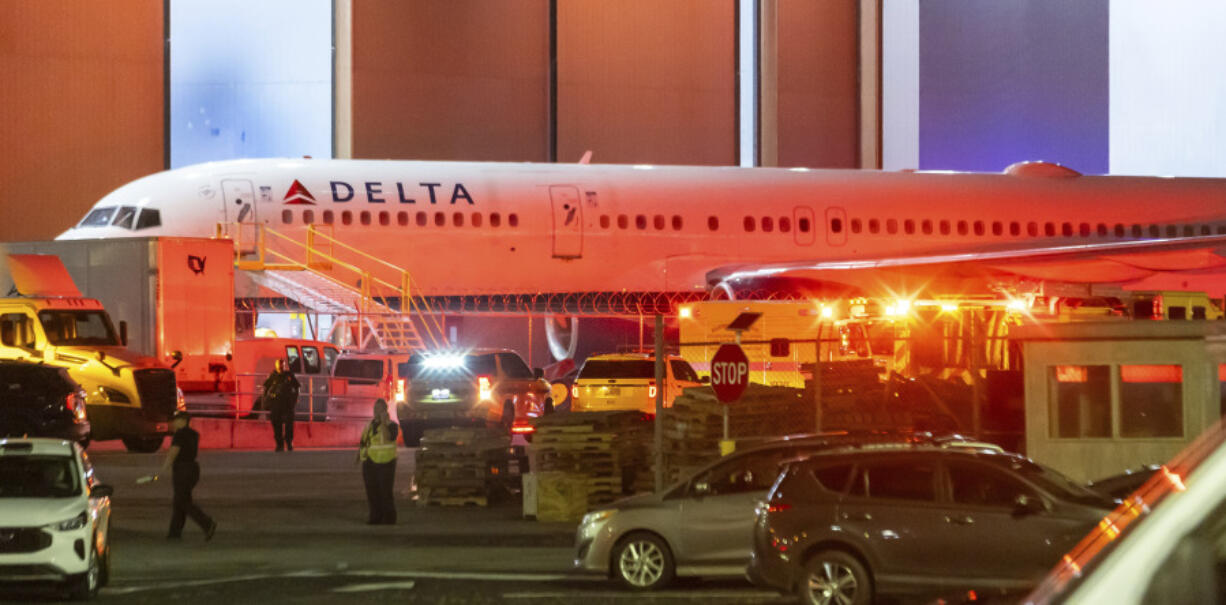 Multiple Atlanta Fire Rescue Department units and police park outside a Delta Maintenance facility near Hartsfield-Jackson International Airport early Tuesday, Aug. 27, 2024 in Atlanta.