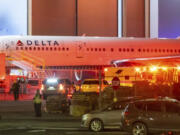 Multiple Atlanta Fire Rescue Department units and police park outside a Delta Maintenance facility near Hartsfield-Jackson International Airport early Tuesday, Aug. 27, 2024 in Atlanta.