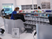 Pharmacy technicians work at a Walgreens pharmacy store in Deerfield, Ill., Thursday, July 25, 2024. America&rsquo;s drugstores are testing smaller locations and making bigger bets on health care as they adjust to customers who need them less for convenience. (AP Photo/Nam Y. Huh) (Nam Y.