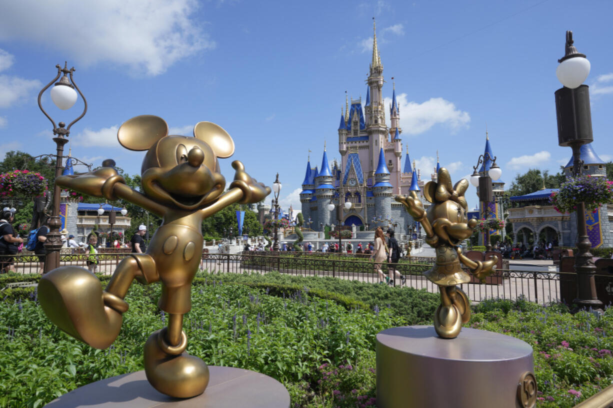 FILE - The Cinderella Castle is seen at the Magic Kingdom at Walt Disney World, July 14, 2023, in Lake Buena Vista, Fla.