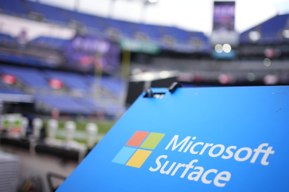 File - A Microsoft Surface logo is seen before an NFL football game between the Houston Texans and the Baltimore Ravens, on Jan. 20, 2024, in Baltimore. Microsoft reports earnings on Tuesday, July 30, 2024.