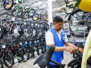 FILE - A worker organizes bicycles at a Walmart Superstore in Secaucus, New Jersey, July 11, 2024. Last month&rsquo;s rise in the unemployment rate has set off new worries about the threat of a recession, but it could also be a false alarm. The distorted post-pandemic economy has already confounded a host of traditional recession signals, at least so far.