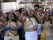 FILE - Waorani Indigenous women take part in a demonstration in Quito, Ecuador, Aug. 20, 2024, demanding authorities comply with the decision to halt oil drilling in a national park in the heart of the country&rsquo;s share of the Amazon where they live.