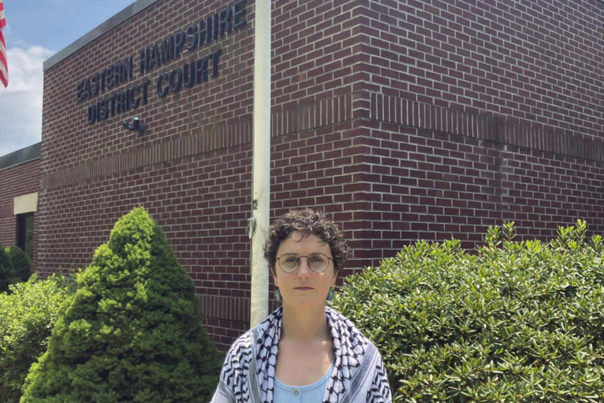 Annie McGrew, an economics graduate student at the University of Massachusetts Amherst, stands for a portrait in front of the Eastern Hampshire District Court in Belchertown, Mass., Wednesday, July 17, 2024. She is facing misdemeanor charges.