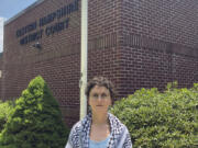 Annie McGrew, an economics graduate student at the University of Massachusetts Amherst, stands for a portrait in front of the Eastern Hampshire District Court in Belchertown, Mass., Wednesday, July 17, 2024. She is facing misdemeanor charges.