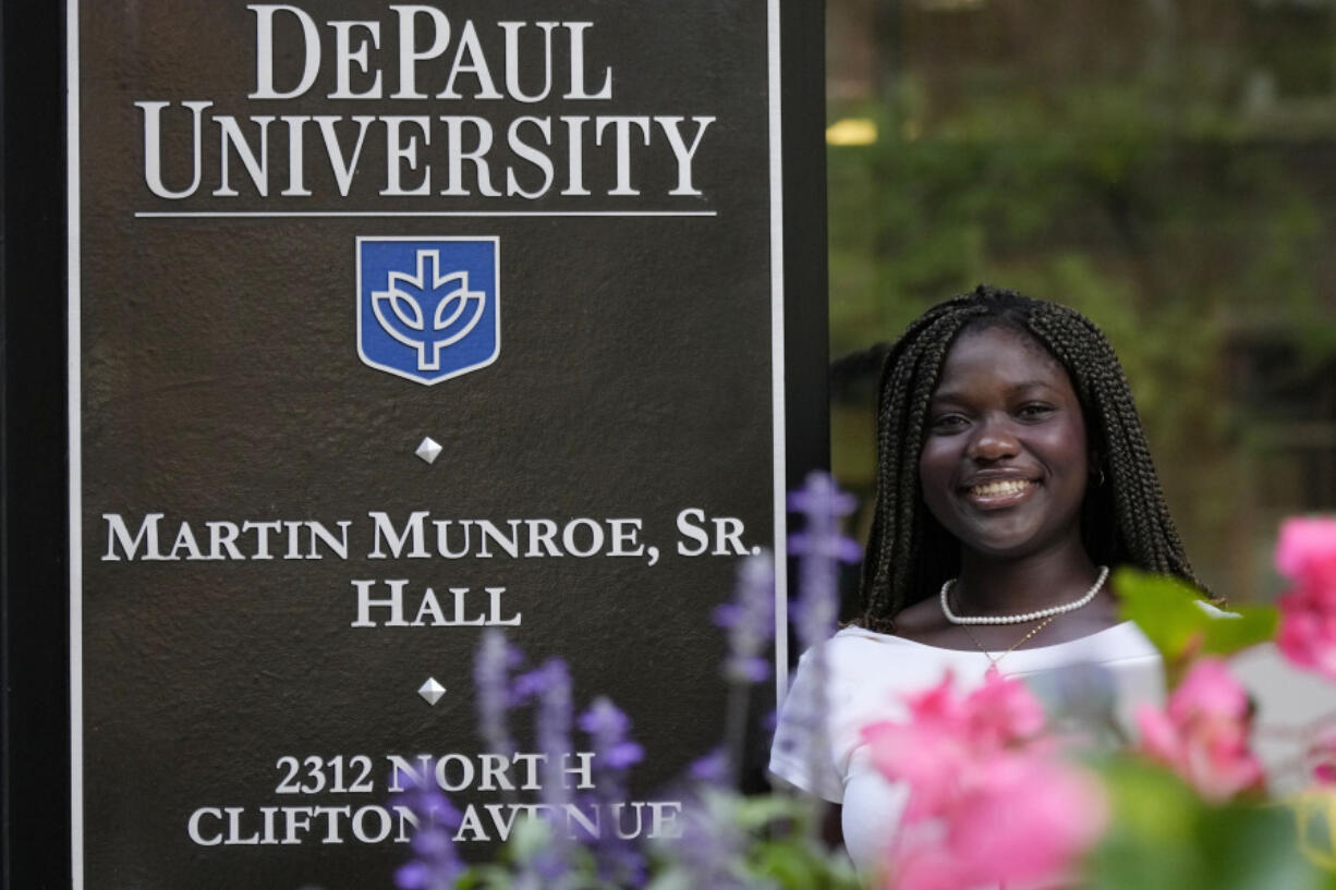 Adjovi Golo poses for photos at DePaul University in Chicago, Wednesday, Aug. 28, 2024. (AP Photo/Nam Y.