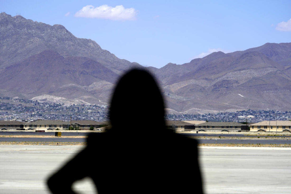 FILE - Vice President Kamala Harris stands in front of mountains during a news conference, June 25, 2021, at the airport after her tour of the U.S. Customs and Border Protection Central Processing Center in El Paso, Texas.