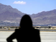 FILE - Vice President Kamala Harris stands in front of mountains during a news conference, June 25, 2021, at the airport after her tour of the U.S. Customs and Border Protection Central Processing Center in El Paso, Texas.