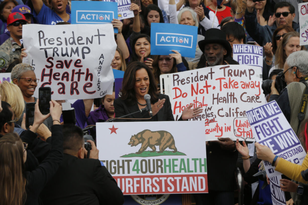 FILE - Sen. Kamala Harris, D-Calif., at podium, cheers health care workers to save the Affordable Care Act across the country outside LAC+USC Medical Center in Los Angeles, Sunday, Jan. 15, 2017, in advance of President-elect Donald Trump&rsquo;s inauguration on Jan. 20.