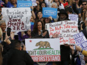 FILE - Sen. Kamala Harris, D-Calif., at podium, cheers health care workers to save the Affordable Care Act across the country outside LAC+USC Medical Center in Los Angeles, Sunday, Jan. 15, 2017, in advance of President-elect Donald Trump&rsquo;s inauguration on Jan. 20.