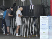 FILE - Voters cast their ballots in Florida&rsquo;s primary election, Tuesday, Aug. 20, 2024, at a polling place inside the Indian Creek Fire Station in Miami Beach, Fla.