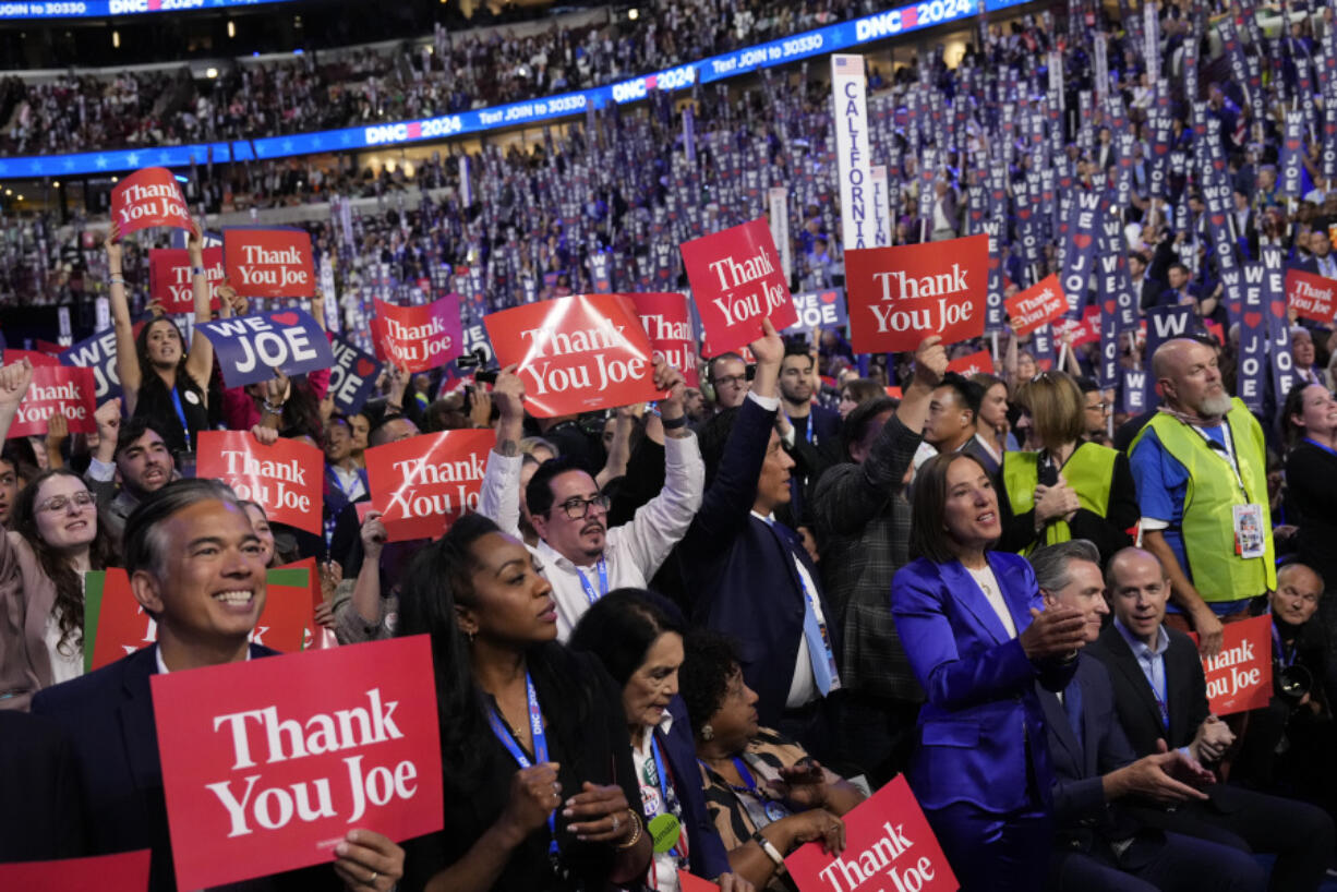 Delegates cheer as President Joe Biden speaks during the first day of Democratic National Convention, Monday, Aug. 19, 2024, in Chicago.