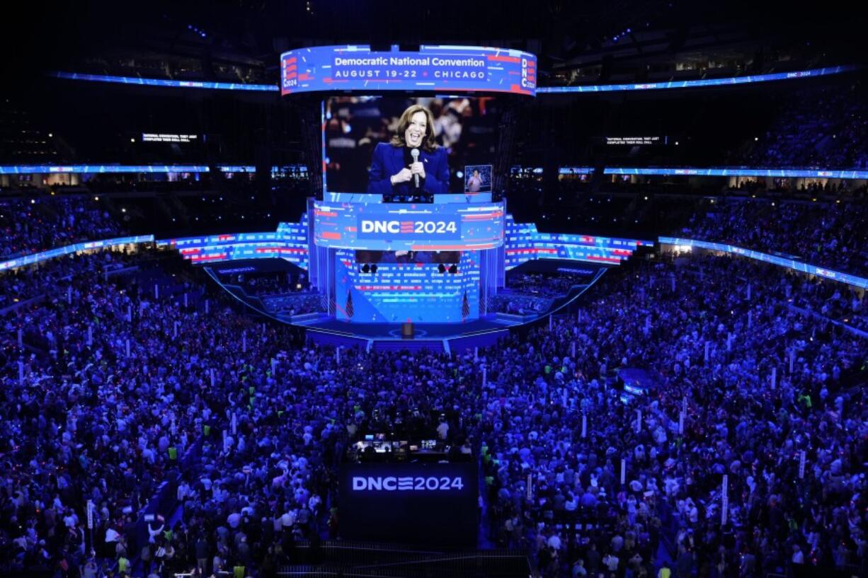 Democratic presidential nominee Vice President Kamala Harris is seen on a video monitor during the Democratic National Convention Tuesday, Aug. 20, 2024, in Chicago. (AP Photo/J.