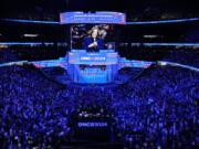 Democratic presidential nominee Vice President Kamala Harris is seen on a video monitor during the Democratic National Convention Tuesday, Aug. 20, 2024, in Chicago. (AP Photo/J.