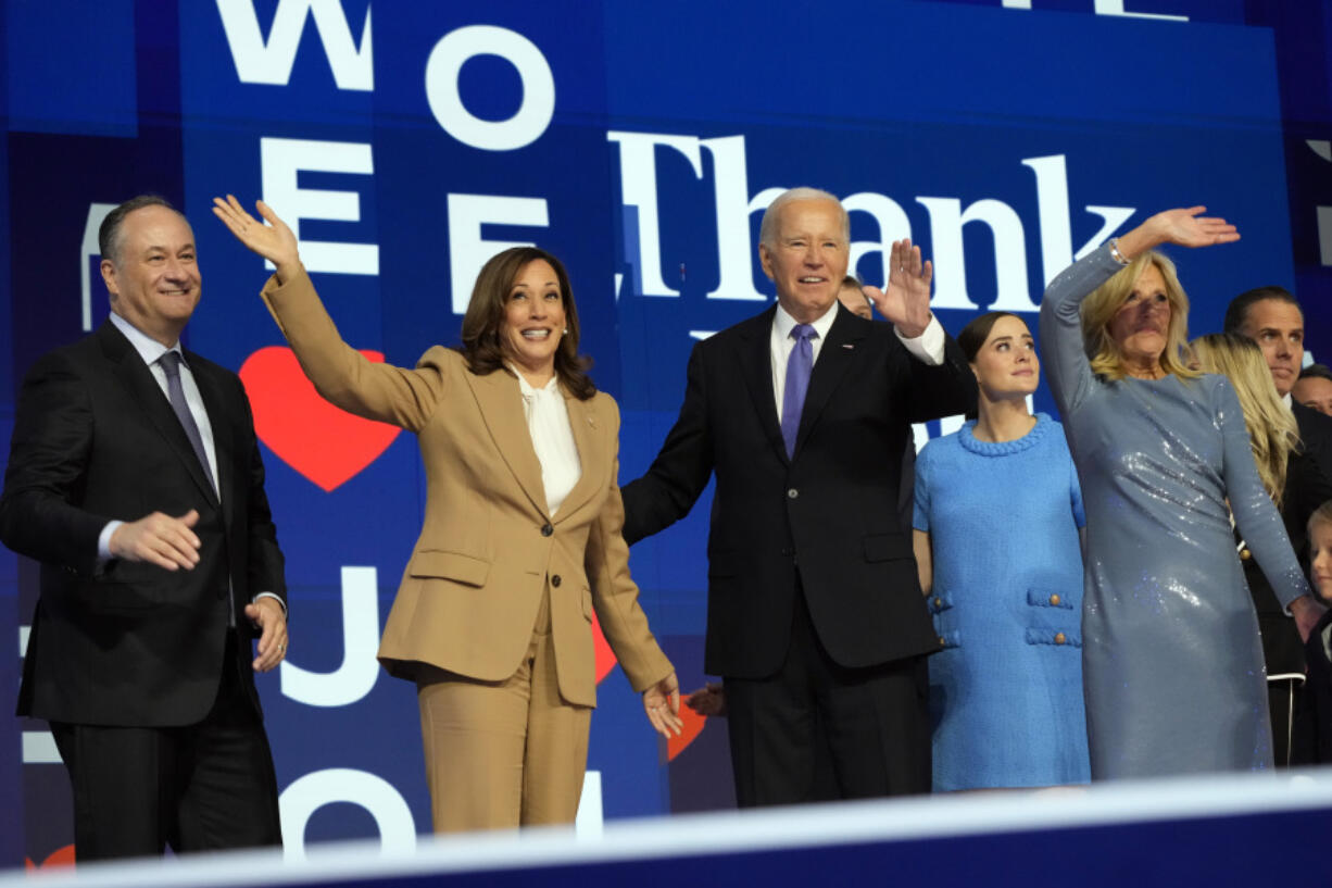 President Joe Biden and first lady Jill Biden stand on stage with Democratic presidential nominee Vice President Kamala Harris and second gentleman Doug Emhoff during the first day of Democratic National Convention, Monday, Aug. 19, 2024, in Chicago.