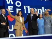 President Joe Biden and first lady Jill Biden stand on stage with Democratic presidential nominee Vice President Kamala Harris and second gentleman Doug Emhoff during the first day of Democratic National Convention, Monday, Aug. 19, 2024, in Chicago.