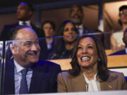 Second gentleman Doug Emhoff, left, and Democratic presidential nominee Vice President Kamala Harris listen during speeches at the Democratic National Convention, Monday, Aug. 19, 2024, in Chicago.