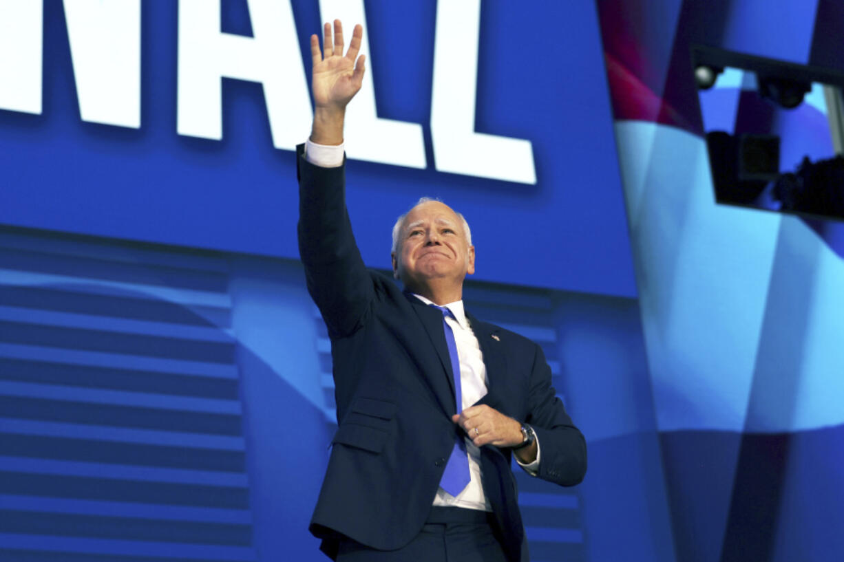 Democratic vice presidential candidate Minnesota Gov. Tim Walz reacts to audience members as he speaks during the third day of the Democratic National Convention in Chicago, on Wednesday, Aug. 21, 2024. (Yalonda M.