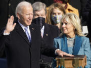 FILE - Joe Biden is sworn in as the 46th president of the United States by Chief Justice John Roberts as Jill Biden holds the Bible during the 59th Presidential Inauguration at the U.S. Capitol in Washington, Jan. 20, 2021.