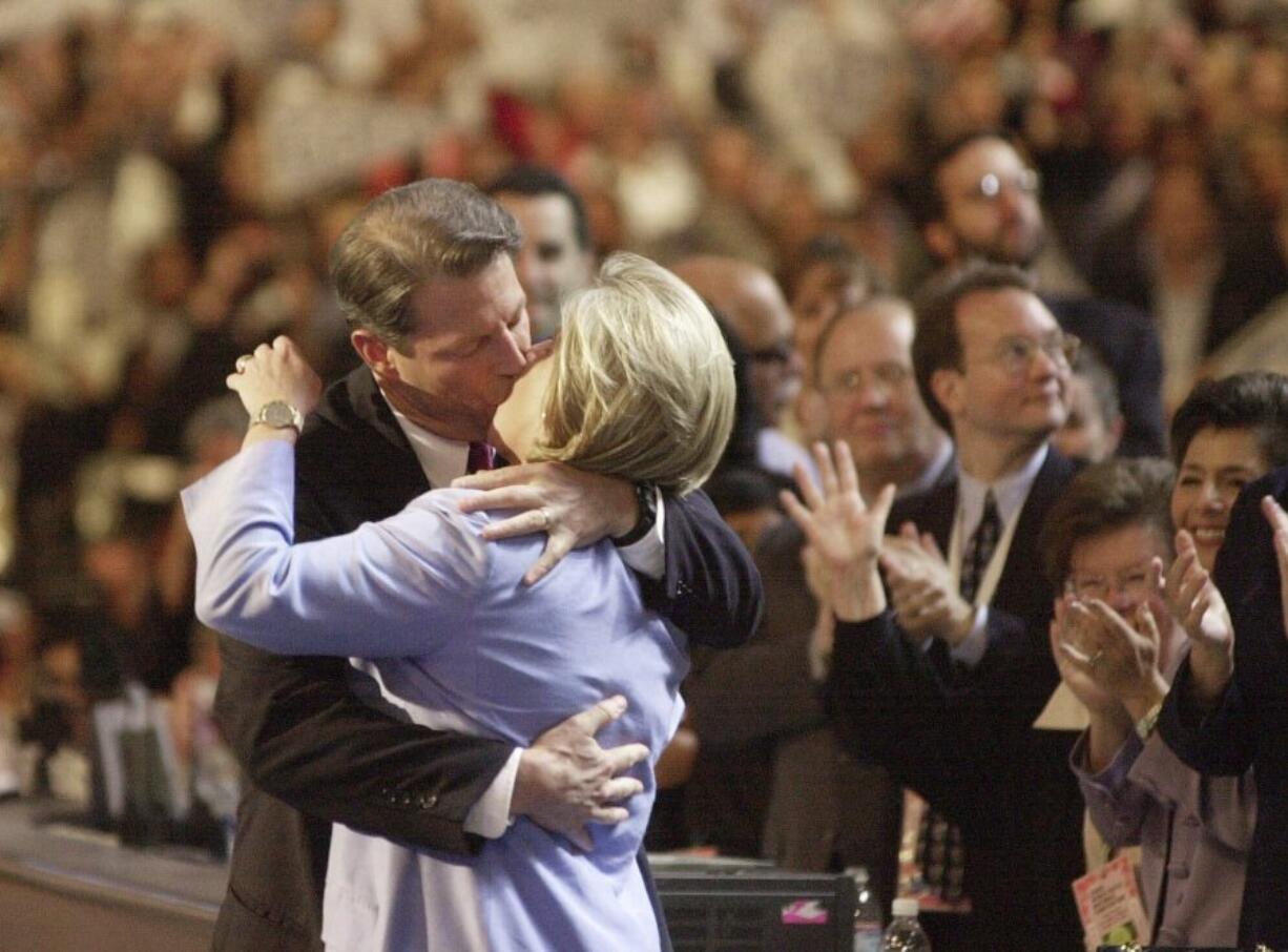 FILE - Democratic presidential nominee Al Gore kisses his wife, Tipper Gore on the stage at the Democratic National Convention, Aug. 17, 2000, in Los Angeles. (AP Photo/ David J.