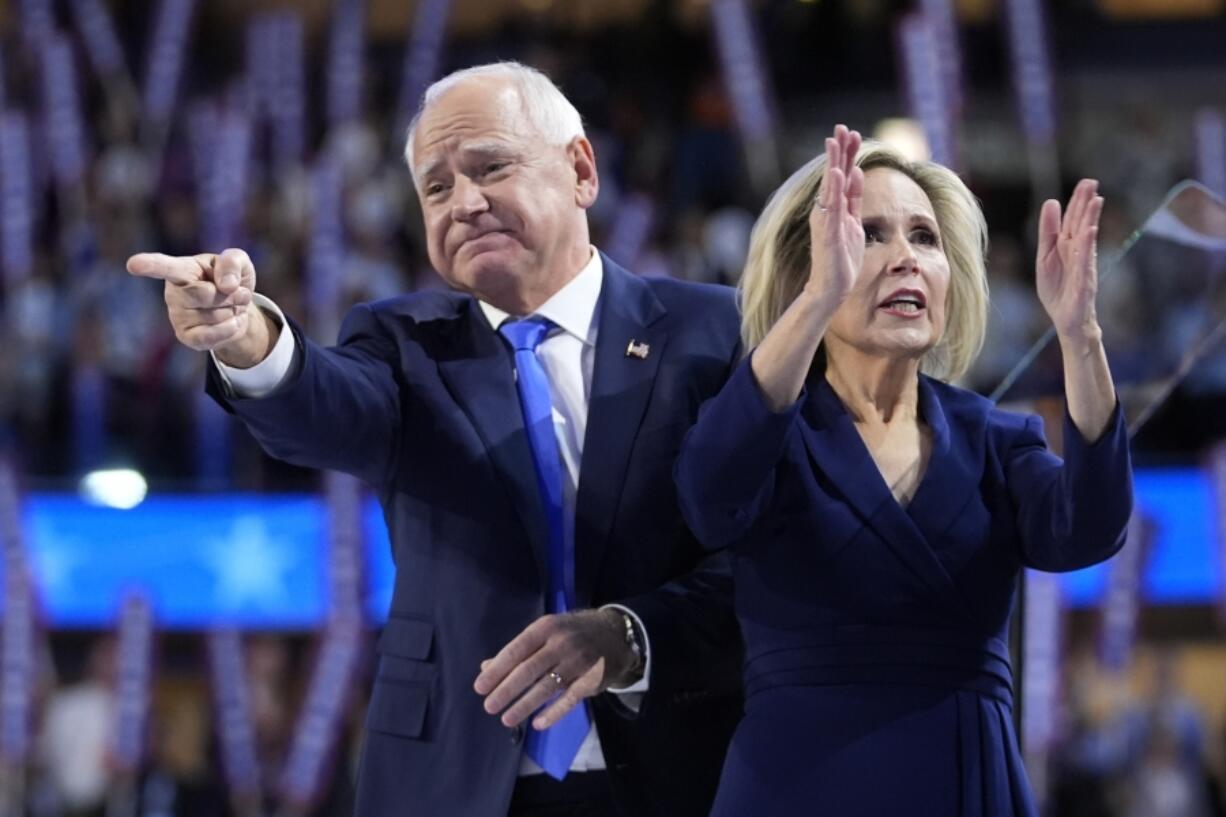 Democratic vice presidential nominee Minnesota Gov. Tim Walz and wife Gwen react during the Democratic National Convention Wednesday, Aug. 21, 2024, in Chicago.