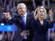 Democratic vice presidential nominee Minnesota Gov. Tim Walz and wife Gwen react during the Democratic National Convention Wednesday, Aug. 21, 2024, in Chicago.