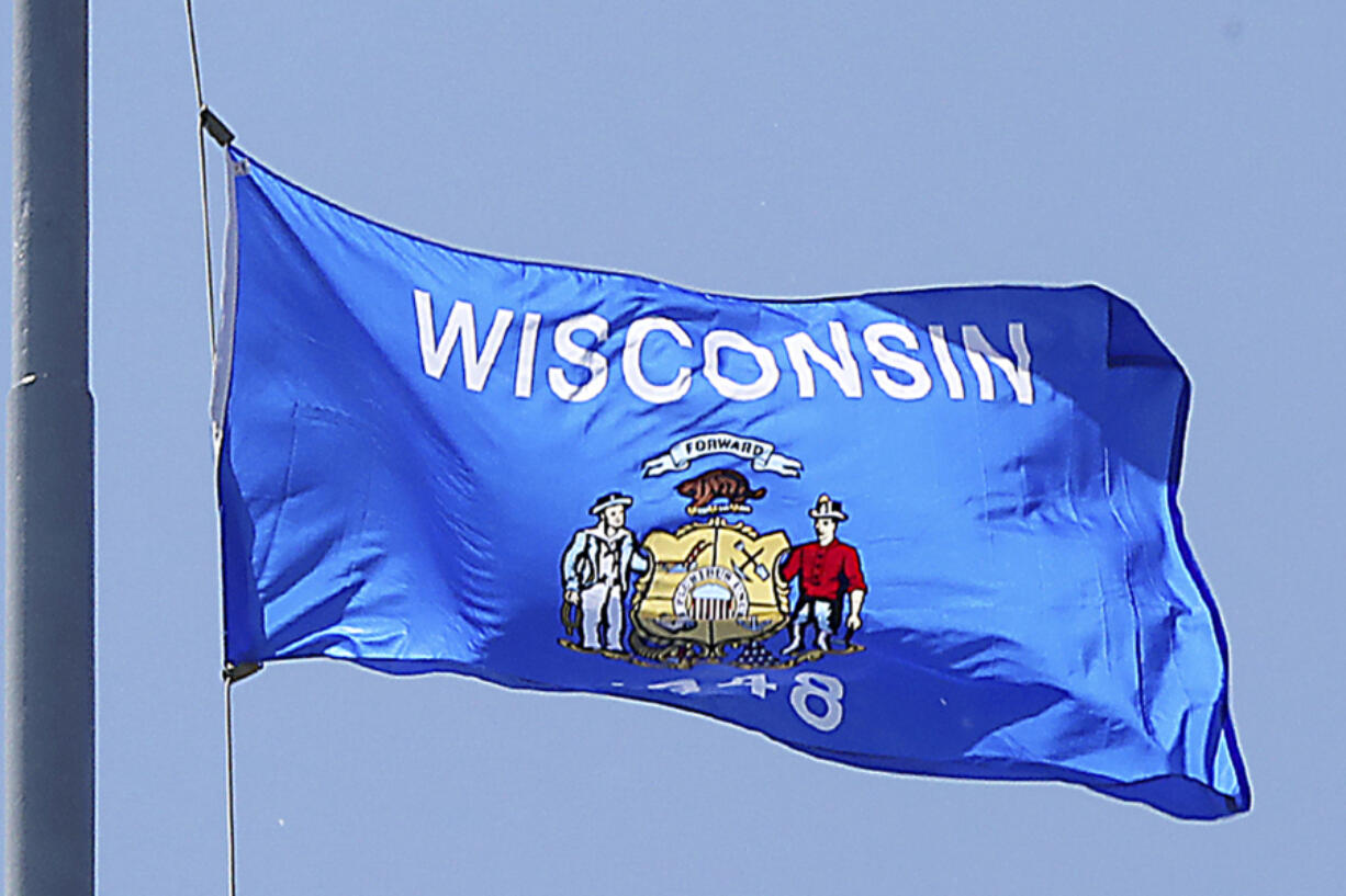 FILE - The Wisconsin state flag is seen in Madison, Wis., June 7, 2019.