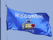 FILE - The Wisconsin state flag is seen in Madison, Wis., June 7, 2019.