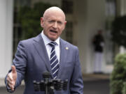 FILE - Sen. Mark Kelly, D-Ariz., speaks about the southern border outside the West Wing of the White House, Tuesday, June 4, 2024, in Washington.