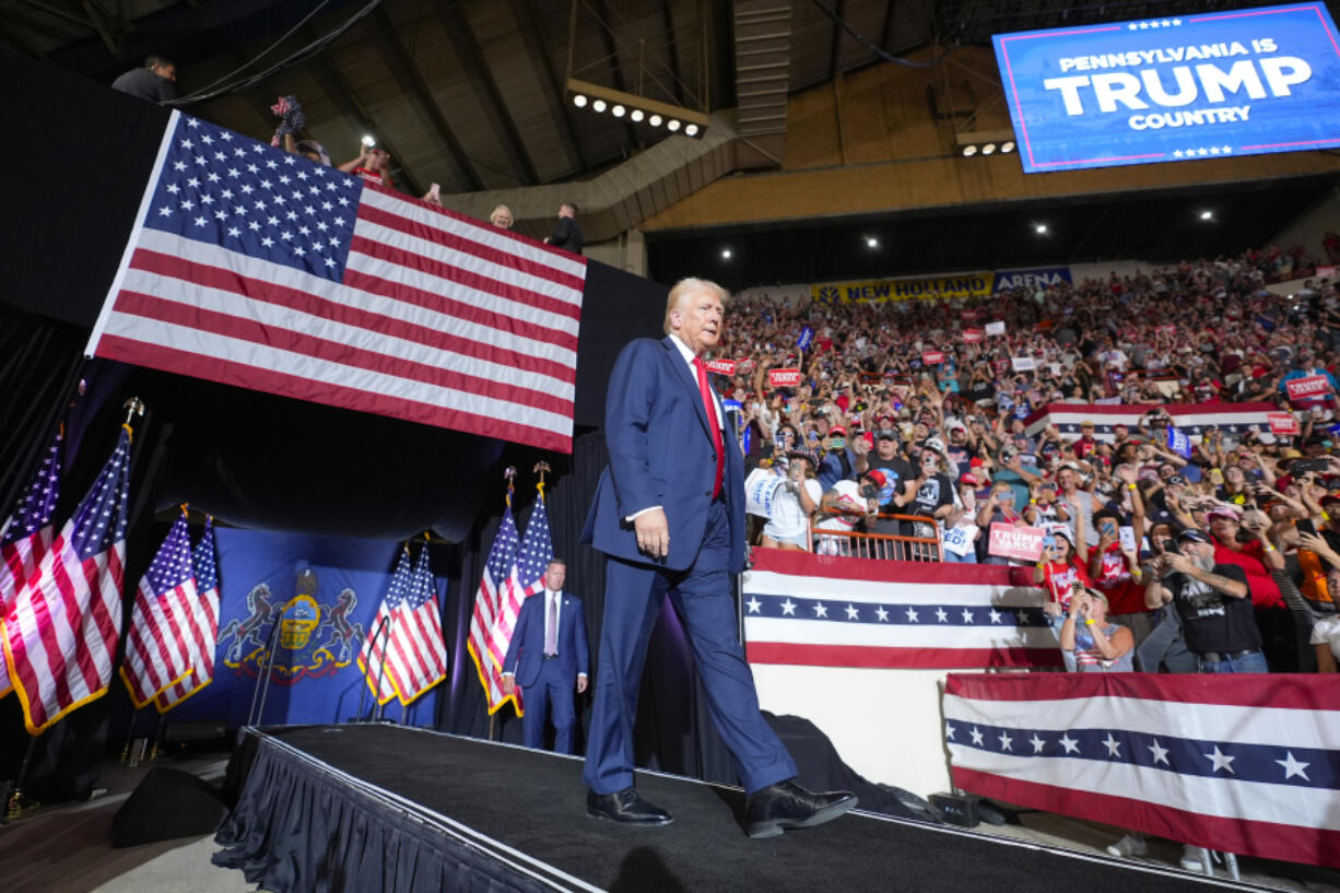 FILE - Republican presidential candidate former President Donald Trump arrives to speak at a campaign rally, July 31, 2024, in Harrisburg, Pa. Facing the need to win Pennsylvania, Vice President Kamala Harris has sworn off any prior assertion that she opposed fracking. But that hasn&rsquo;t stopped Trump from wielding her now-abandoned position as to win over working-class voters in the key battleground state where the industry means jobs.