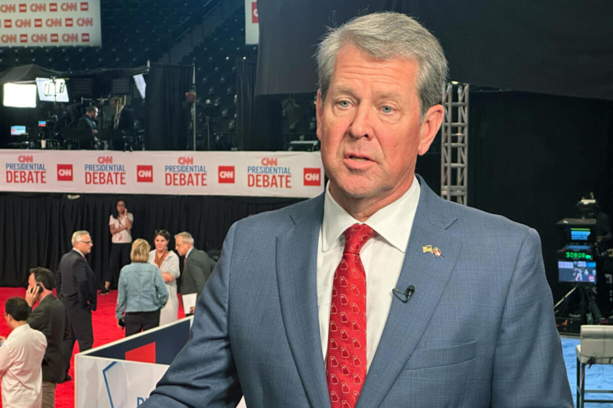 FILE - Georgia Gov. Brian Kemp speaks in the spin room before a presidential debate between President Joe Biden and Republican presidential candidate former President Donald Trump in Atlanta, June 27, 2024.