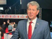 FILE - Georgia Gov. Brian Kemp speaks in the spin room before a presidential debate between President Joe Biden and Republican presidential candidate former President Donald Trump in Atlanta, June 27, 2024.