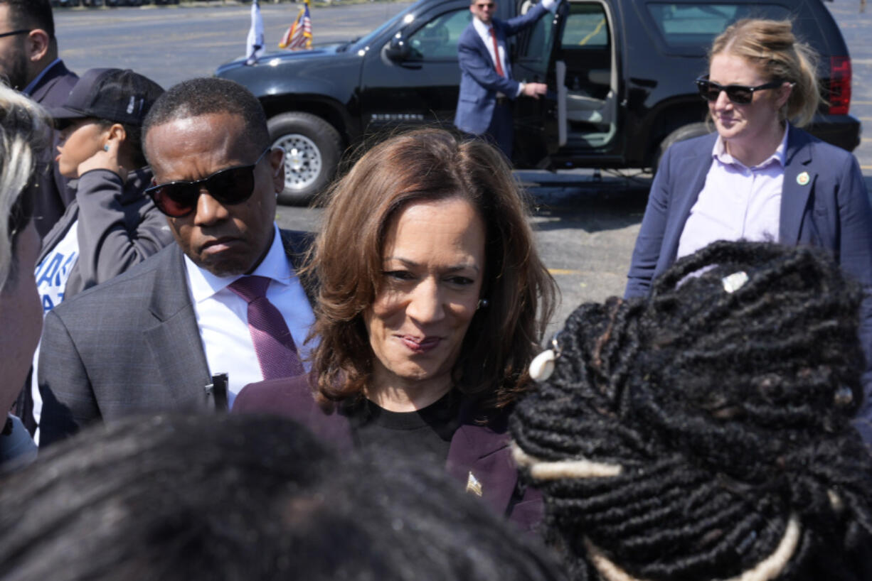 Democratic presidential nominee Vice President Kamala Harris greets supporters before boarding Marine Two at Soldier Field in Chicago, Friday, Aug. 23, 2024, en route to Washington after attending the Democratic National Convention.