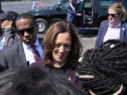 Democratic presidential nominee Vice President Kamala Harris greets supporters before boarding Marine Two at Soldier Field in Chicago, Friday, Aug. 23, 2024, en route to Washington after attending the Democratic National Convention.