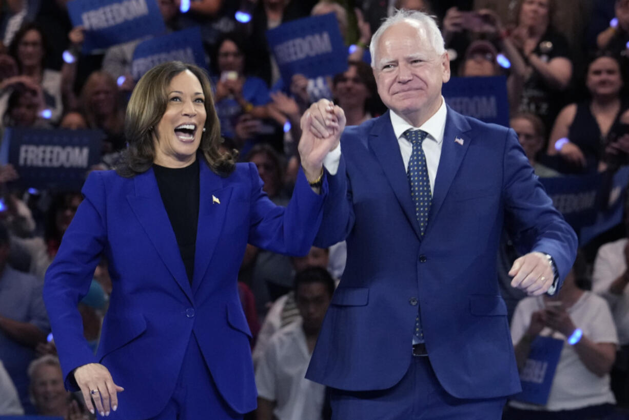 Democratic presidential nominee Vice President Kamala Harris and running mate Minnesota Gov. Tim Walz appear at the Fiserv Forum during a campaign rally in Milwaukee, Tuesday, Aug. 20, 2024.