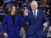 Democratic presidential nominee Vice President Kamala Harris and running mate Minnesota Gov. Tim Walz appear at the Fiserv Forum during a campaign rally in Milwaukee, Tuesday, Aug. 20, 2024.