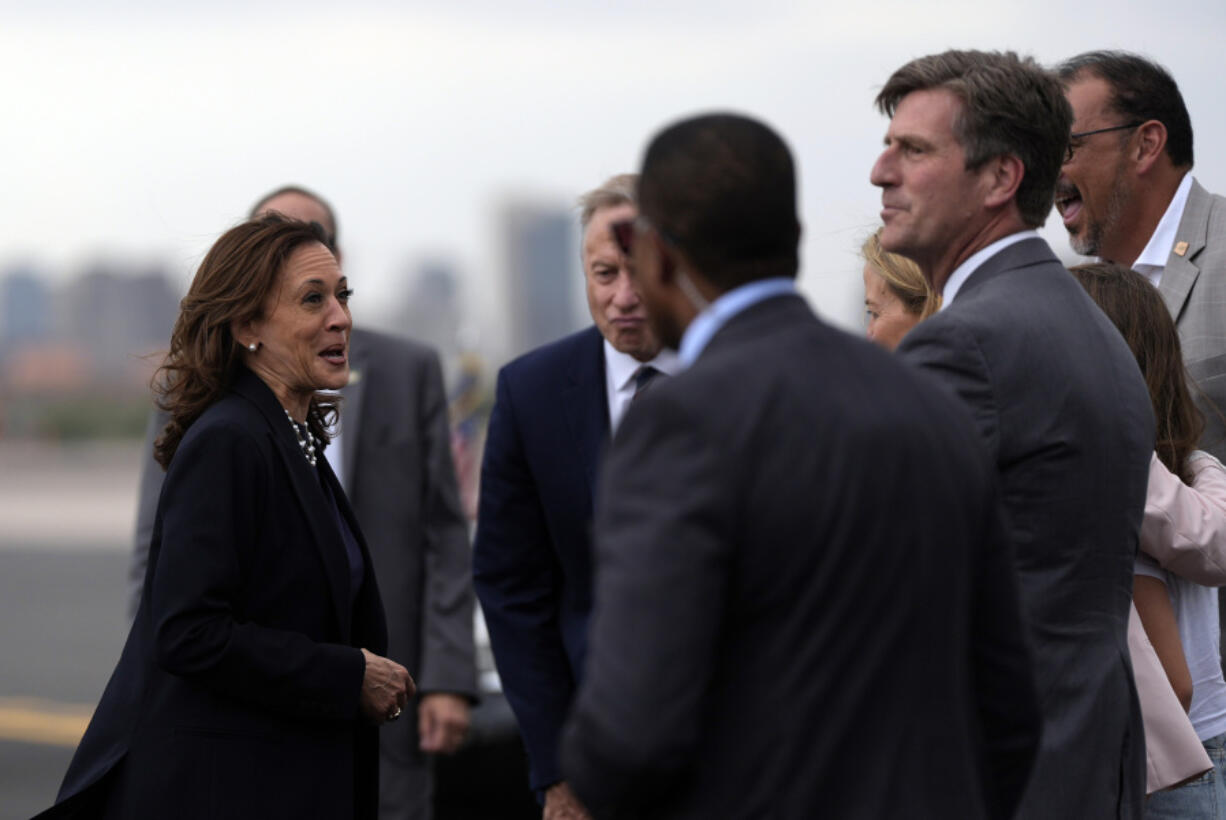 Democratic presidential nominee Vice President Kamala Harris talks after arriving on Air Force Two at Phoenix Sky Harbor International Airport, Thursday, Aug. 8, 2024, in Phoenix.