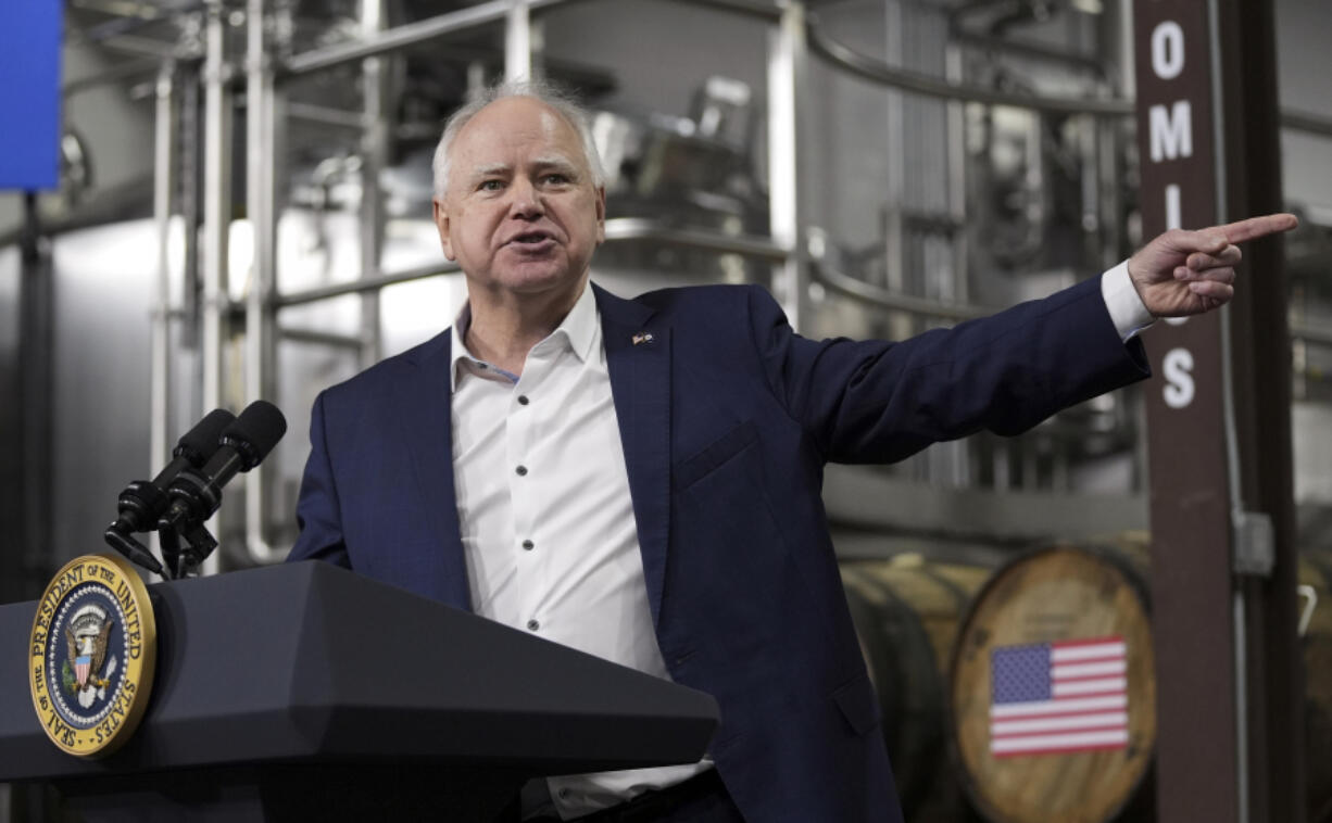 FILE - Gov. Tim Walz, D-Minn., speaks before President Joe Biden at the Earth Rider Brewery, Jan. 25, 2024, in Superior, Wis.