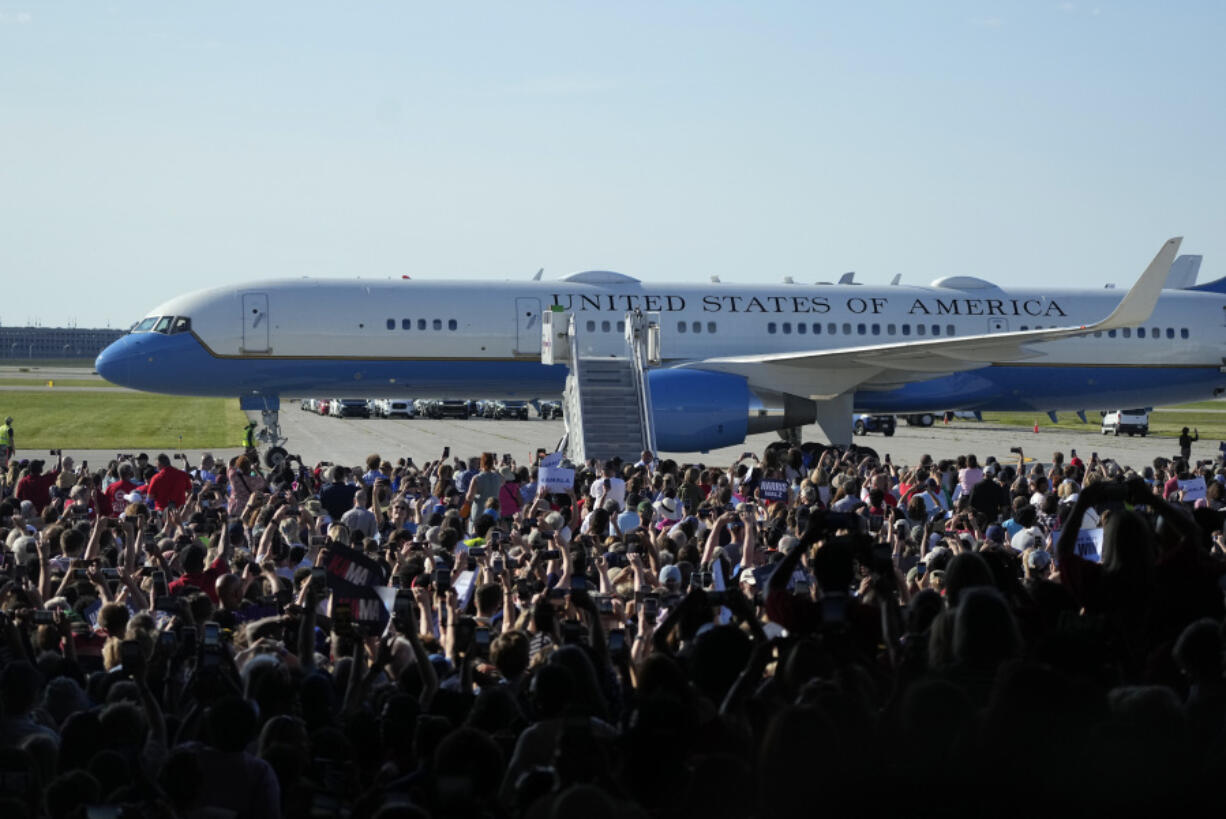 Air Force Two with Democratic presidential nominee Vice President Kamala Harris and her running mate Minnesota Gov. Tim Walz aboard arrive for a campaign rally Wednesday, Aug. 7, 2024, in Romulus, Mich.