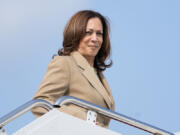 FILE - Vice President Kamala Harris boards Air Force Two as she departs Westfield-Barnes Regional Airport in Westfield, Mass., July 27, 2024.