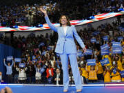 FILE - Vice President Kamala Harris waves during a campaign rally, July 30, 2024, in Atlanta.