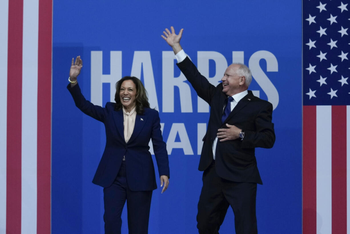 Democratic presidential nominee Vice President Kamala Harris and her running mate Minnesota Gov. Tim Walz arrive at a campaign rally in Philadelphia, Tuesday, Aug. 6, 2024.