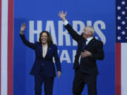 Democratic presidential nominee Vice President Kamala Harris and her running mate Minnesota Gov. Tim Walz arrive at a campaign rally in Philadelphia, Tuesday, Aug. 6, 2024.