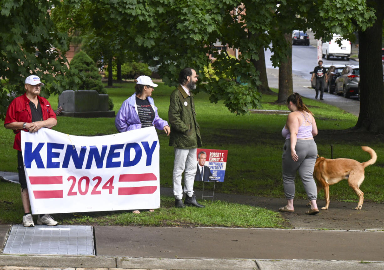 A small group of supporters wait for Independent presidential candidate Robert F. Kennedy Jr., to arrive at the Albany County Courthouse, Wednesday, Aug. 7, 2024, in Albany, N.Y.