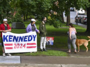 A small group of supporters wait for Independent presidential candidate Robert F. Kennedy Jr., to arrive at the Albany County Courthouse, Wednesday, Aug. 7, 2024, in Albany, N.Y.