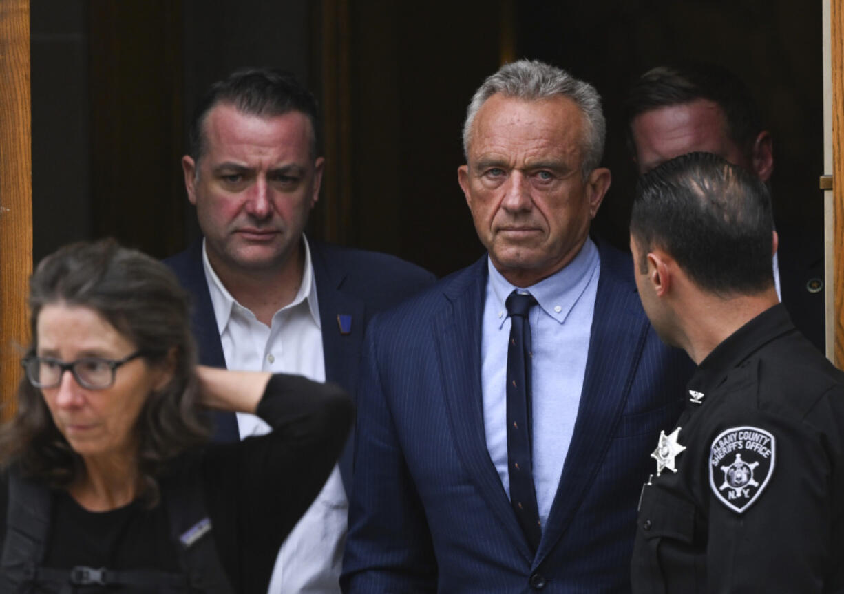 FILE - Independent presidential candidate Robert F. Kennedy Jr., center right, leaves the Albany County Courthouse, Aug. 6, 2024, in Albany, N.Y.